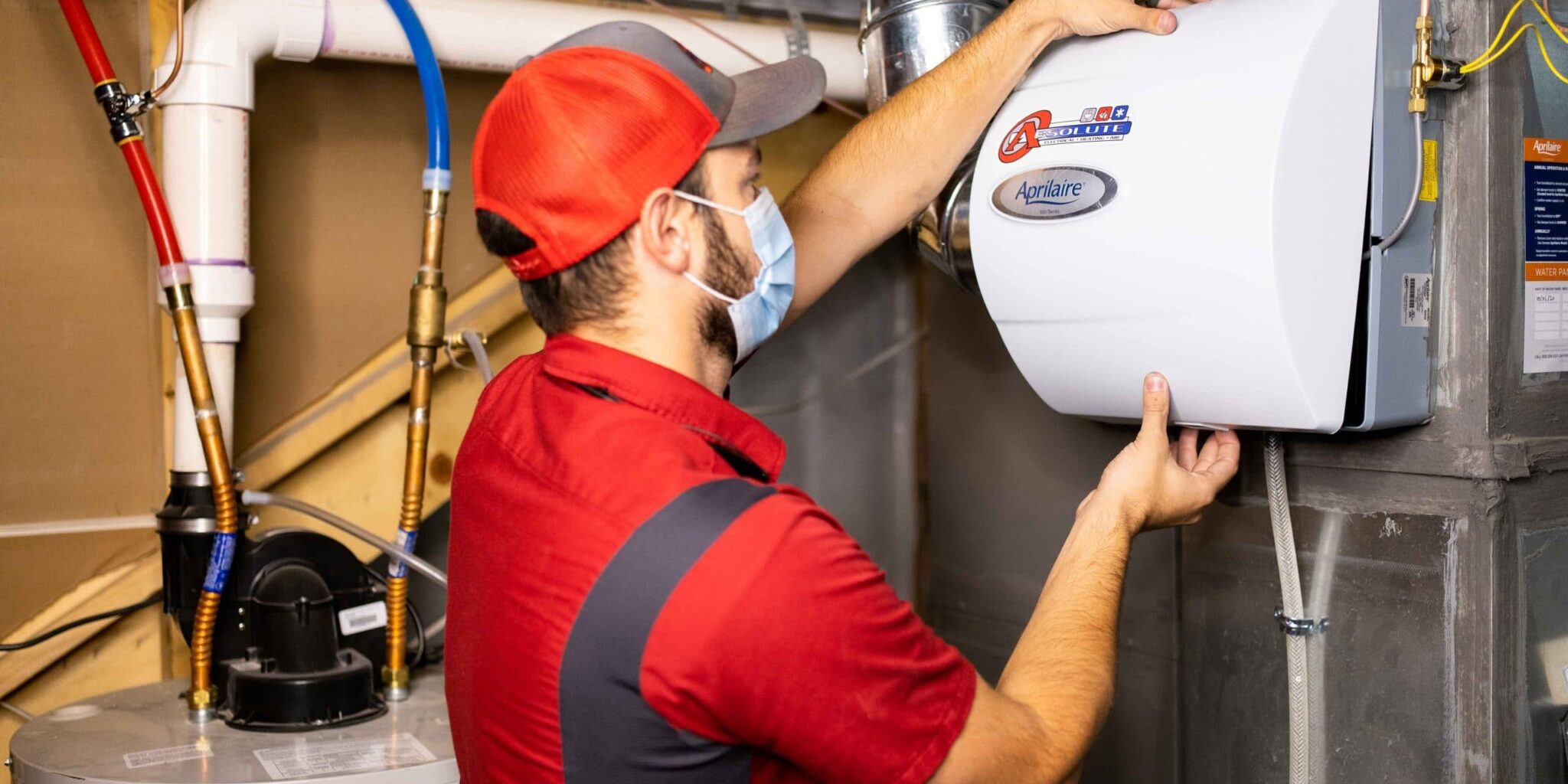 HVAC Technician Installs An Aprilaire Bypass Humidifier In a Customer Home In Denver Colorado