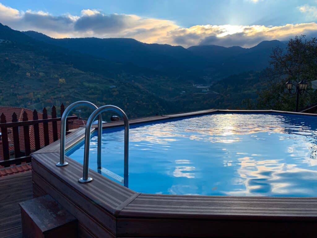 Residential hot tub; mountainous landscape in the background.